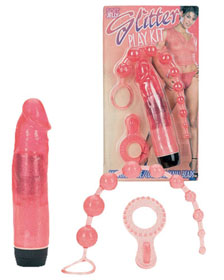 Kit with transparent vibrator, rings & anal balls
